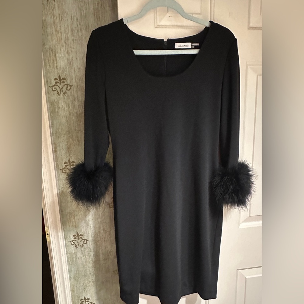 Classic dress..Never worn/too small. Black shift with faux fur cuffs